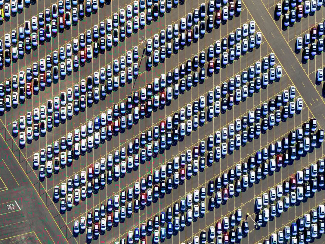 aerial-view-of-a-car-distribution-centre-new-cars-2023-11-27-04-50-26-utc